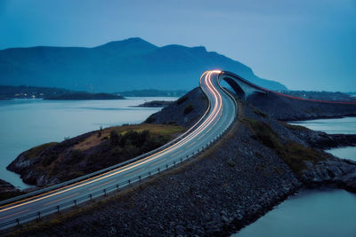 High angle view of road by mountain against sky