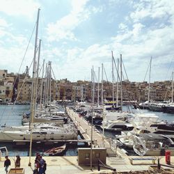 Boats moored at harbor