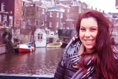 Portrait of smiling woman in city