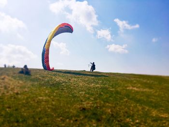 Person on field against sky