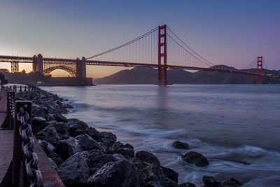 View of suspension bridge over sea