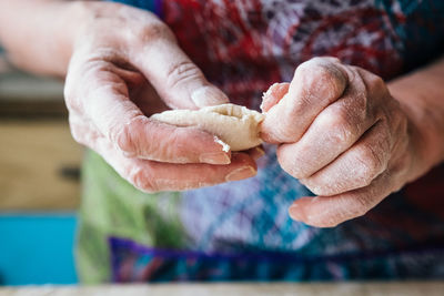 Close-up of man holding hands