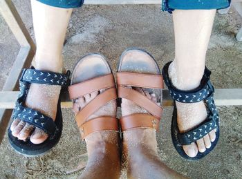 A couple use sandals on the beach