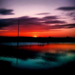 Scenic view of lake at sunset