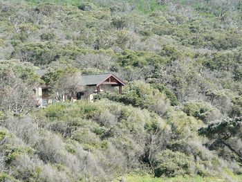 Built structure on landscape against mountain