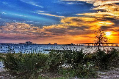 Scenic view of lake against dramatic sky