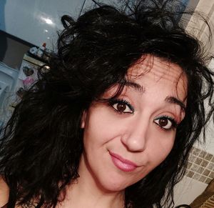 Close-up portrait of smiling young woman