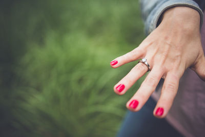 High angle view of woman's hand