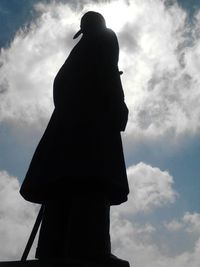 Low angle view of statue against cloudy sky