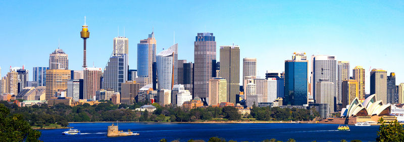 View of modern buildings against blue sky