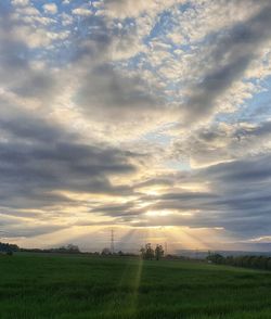 Scenic view of field against sky during sunset