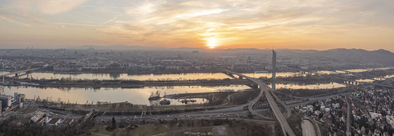 Scenic view of river against sky during sunset