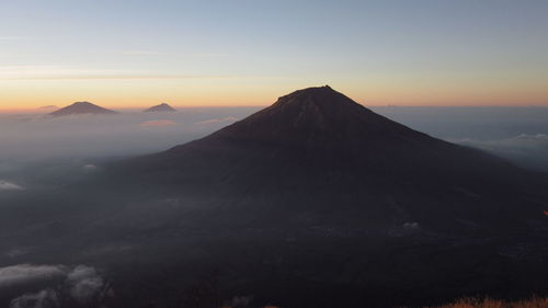Scenic view of mountains against sky during sunset