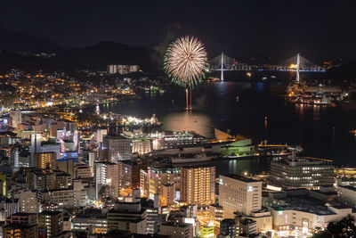 High angle view of illuminated city buildings at night