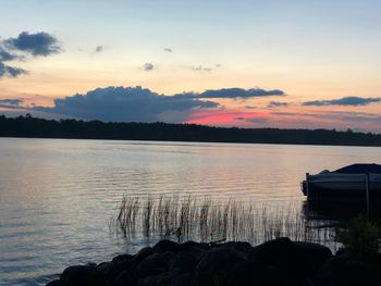 Scenic view of lake against sky during sunset