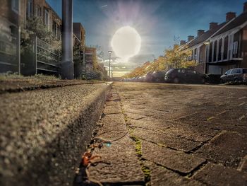 Railroad track in city against sky
