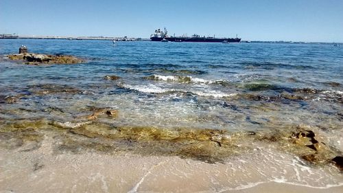 Scenic view of sea against clear sky