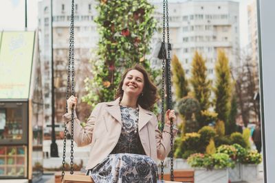 Smiling young woman looking away outdoors