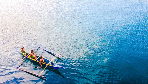 People enjoying in boat on water