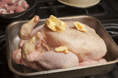 Close-up of fresh chickens in metallic container