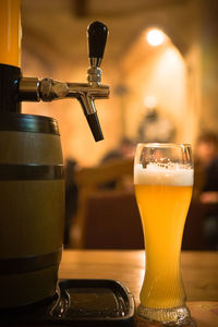 Close-up of beer glass on table