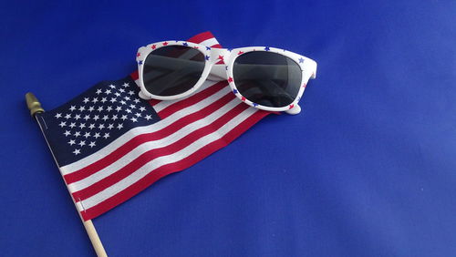 Close-up of flag against blue sky