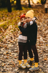 Rear view of father and son during autumn