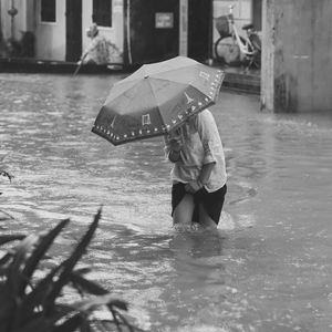 Man with umbrella in rain