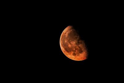 Low angle view of moon against sky at night