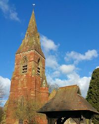 Low angle view of church against blue sky