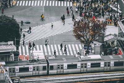 High angle view of people crossing road