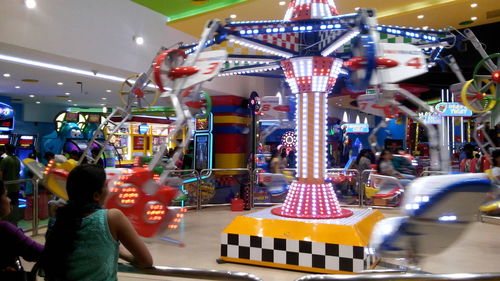 Illuminated carousel in amusement park