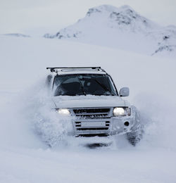 View of car on snow covered mountain