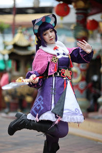 Portrait of young woman in traditional clothing