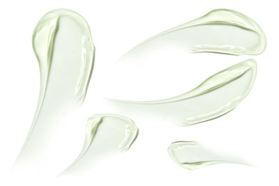 Close-up of spoons against white background