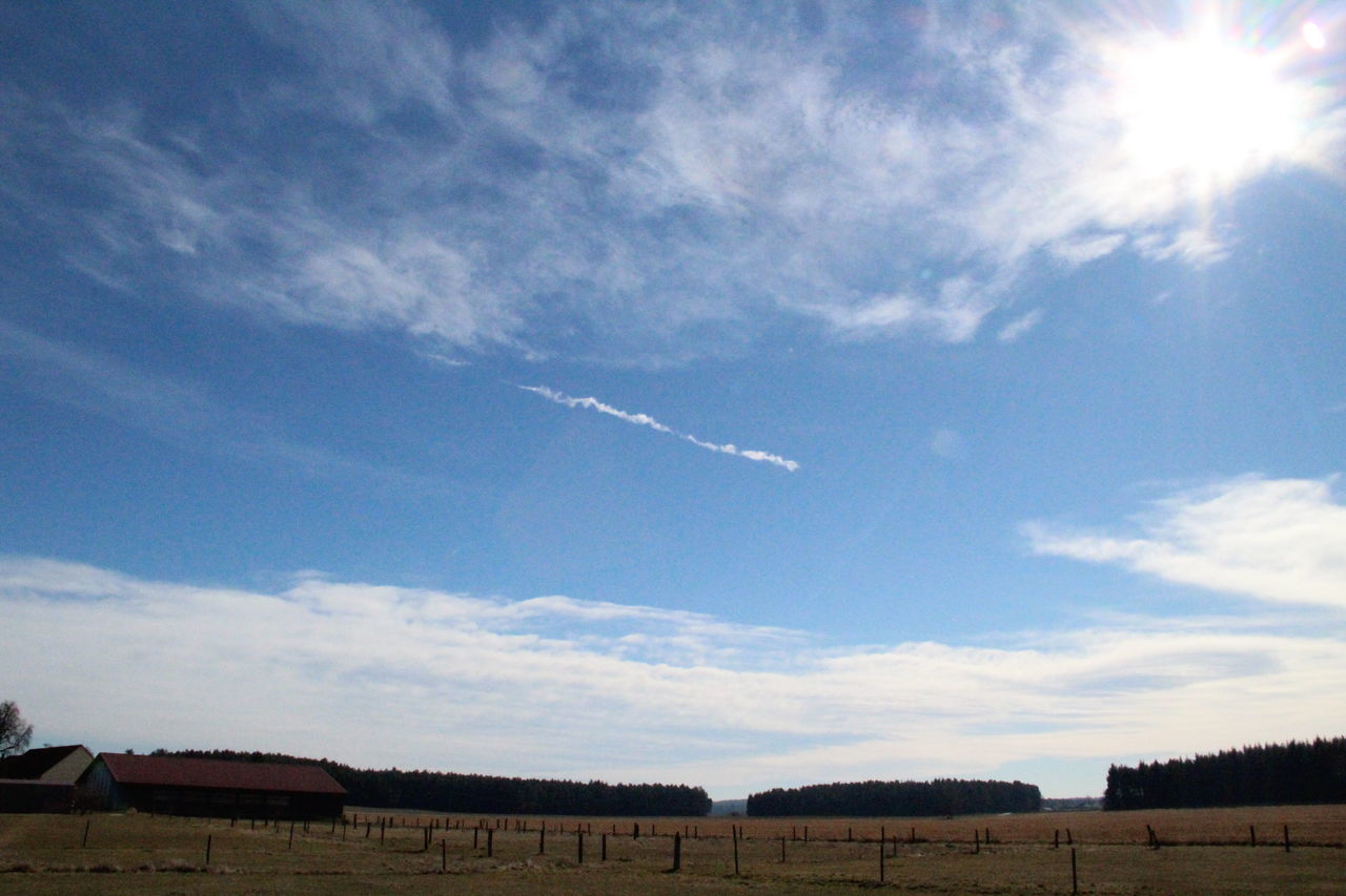 sky, blue, low angle view, beauty in nature, nature, no people, vapor trail, outdoors, scenics, cloud - sky, antenna - aerial, day