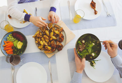 High angle view of woman holding food