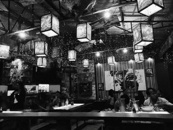 Group of people in restaurant at night