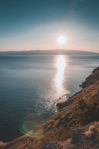 Scenic view of sea against clear sky during sunset