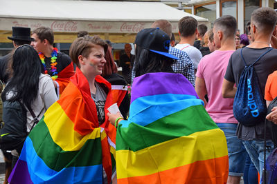 People standing in front of a crowd