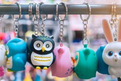 Close-up of key rings hanging for sale at market stall
