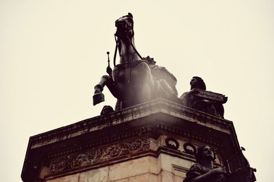 Low angle view of statue against clear sky