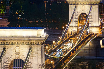 Illuminated suspension bridge at night