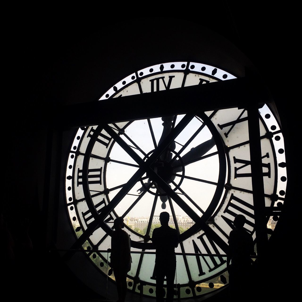 silhouette, low angle view, leisure activity, indoors, lifestyles, built structure, men, ferris wheel, architecture, circle, arts culture and entertainment, time, clock, amusement park ride, person, travel, amusement park, sky