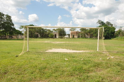 Goal post on  field against sky