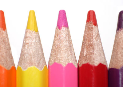 Close-up of colorful pencils on white background