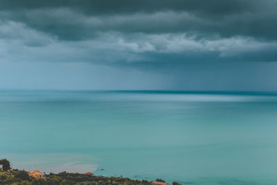 Scenic view of turquoise sea against sky