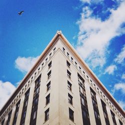 Low angle view of building against blue sky