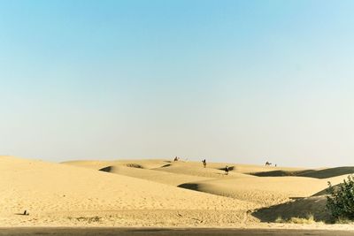 Scenic view of desert against clear sky