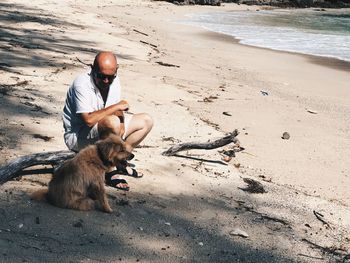 Man with dog on beach